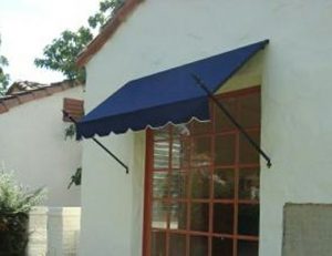 Residential spearhead awning with blue awning fabric