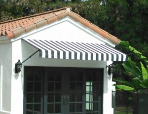 Black and white striped awning fabric on a custom spearhead awning